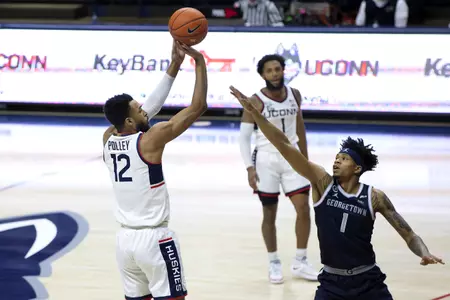 Tyler Polley rises over the defender for the shot in the game against Georgetown at Gampel Pavilion on March 6th 2021