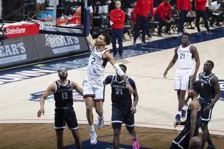 James Bouknight rises to dunk the ball in the game against Georgetown at Gampel Pavilion on March 6th 2021