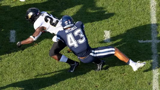 Jackson Mitchell makes a tackle vs. Purdue