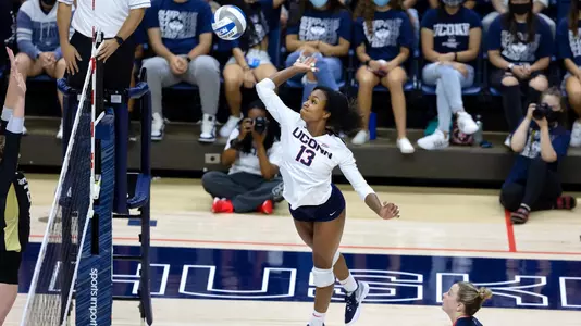 Taylor Pannell midair about to strike the ball