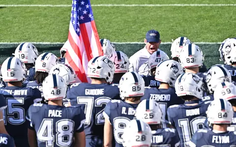 Coach Mora and UConn Football team
