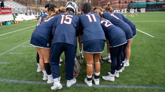 The starting lineup huddling before opening draw at Fairfield