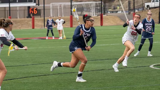 Sydney Watson shooting a free position shot