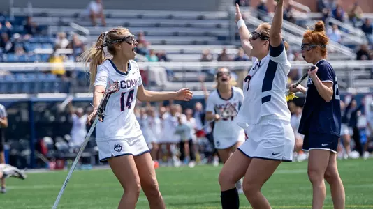 Grace Goetz and Grace Coon celebrating after a goal