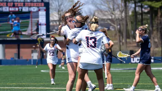 Lauren Barry celebrating with teammates after scoring