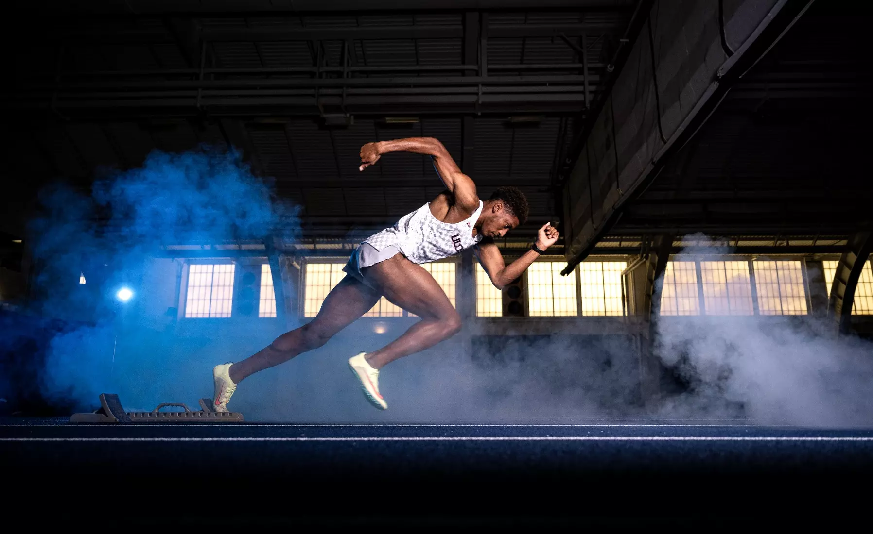 Senior Terrel Williams sprints during a track & field photoshoot in the Hugh S. Greer Field House.