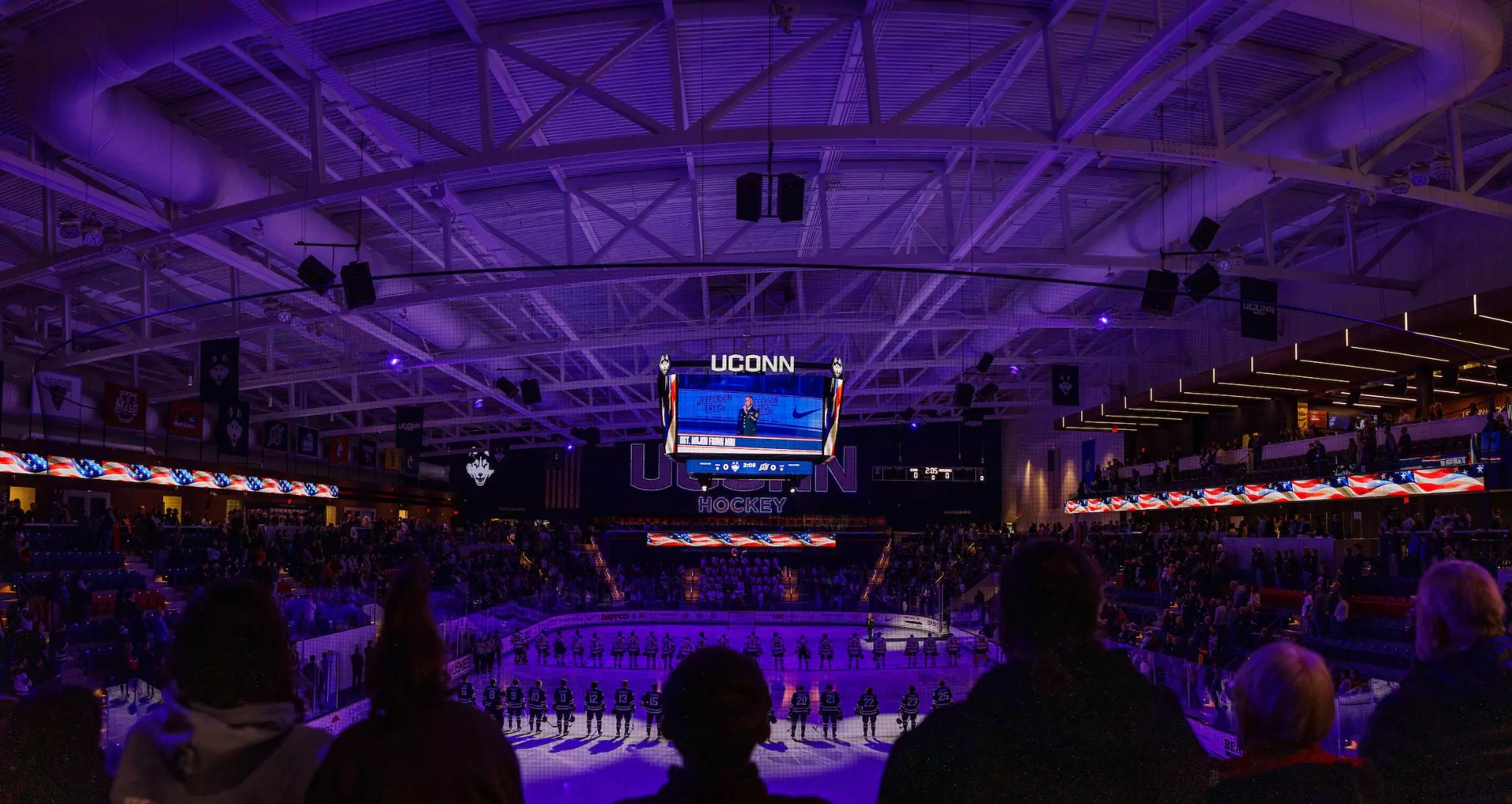Sergeant Major Frank May sings the National Anthem at Huskies & Heroes Night in Toscano Family Ice Forum.