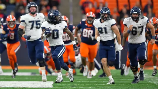 Connecticut running back Cam Edwards (0) runs for a touchdown during the first half of an NCAA football game against Syracuse on Saturday, Nov. 23, 2024 in Syracuse, N.Y.