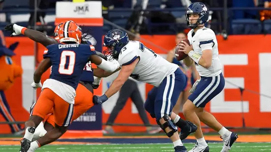 Connecticut quarterback Joe Fagnano (2) looks to pass during the first half of an NCAA football game against Syracuse on Saturday, Nov. 23, 2024 in Syracuse, N.Y.