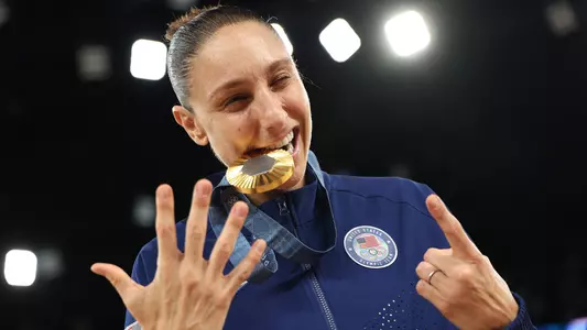 PARIS, FRANCE - AUGUST 11: Gold medalist Diana Taurasi of Team United States holds up the number six, signifying her sixth Olympics gold medal, while posing for a photo during the Women's basketball medal ceremony on day sixteen of the Olympic Games Paris 2024 at Bercy Arena on August 11, 2024 in Paris, France. (Photo by Gregory Shamus/Getty Images)