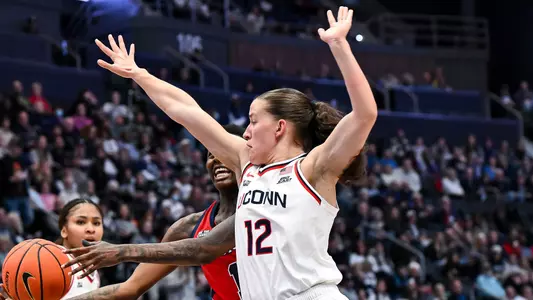 HARTFORD, CONNECTICUT - January 7 - Ashlynn Shade #12 of the UConn Huskies against the St. Johns Red Storm at PeoplesBank Arena in Hartford, CT.
Photo by Simon Asher