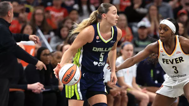 INDIANAPOLIS, INDIANA - APRIL 30: Paige Bueckers #5 of the Dallas Wings controls the ball against Raven Johnson #3 of the Indiana Fever during the first half of a preseason game at Gainbridge Fieldhouse on April 30, 2026 in Indianapolis, Indiana. NOTE TO USER: User expressly acknowledges and agrees that, by downloading and or using this photograph, User is consenting to the terms and conditions of the Getty Images License Agreement. (Photo by Justin Casterline/Getty Images)