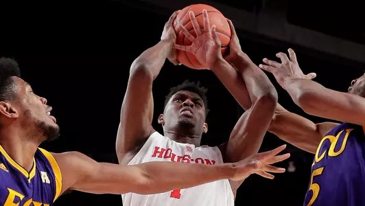 Houston center Chris Harris Jr. (1) pulls in a rebound between East Carolina forward Jayden Gardner (1) and guard Tyler Foster (5) during the first half of an NCAA college basketball game Wednesday, Jan. 23, 2019, in Houston. (AP Photo/Michael Wyke)
