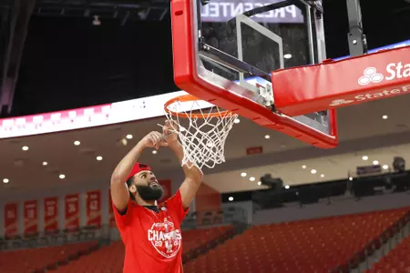 the University of Houston men's basketball cuts down the nets after claiming the 2020 regular season conference championship at the Fertitta Center on Sunday March 8, 2020 in Houston, Texas.Photo by Aaron M. Sprecher