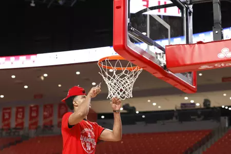 the University of Houston men's basketball cuts down the nets after claiming the 2020 regular season conference championship at the Fertitta Center on Sunday March 8, 2020 in Houston, Texas.Photo by Aaron M. Sprecher