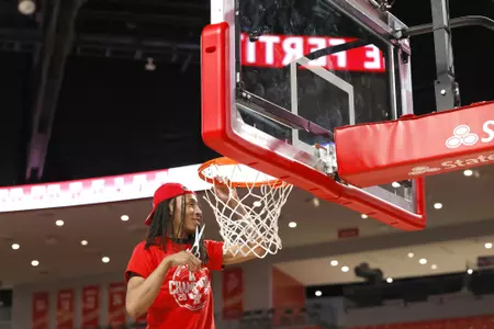 the University of Houston men's basketball cuts down the nets after claiming the 2020 regular season conference championship at the Fertitta Center on Sunday March 8, 2020 in Houston, Texas.Photo by Aaron M. Sprecher