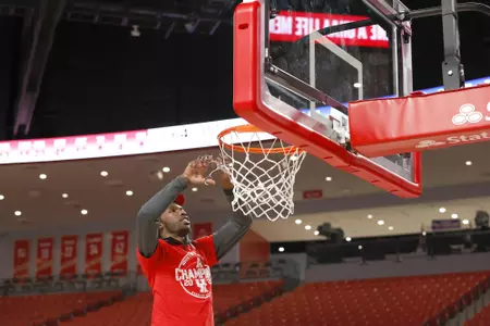 the University of Houston men's basketball cuts down the nets after claiming the 2020 regular season conference championship at the Fertitta Center on Sunday March 8, 2020 in Houston, Texas.Photo by Aaron M. Sprecher