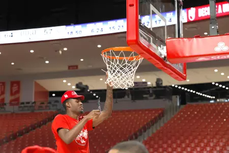 the University of Houston men's basketball cuts down the nets after claiming the 2020 regular season conference championship at the Fertitta Center on Sunday March 8, 2020 in Houston, Texas.Photo by Aaron M. Sprecher
