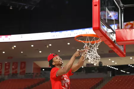 the University of Houston men's basketball cuts down the nets after claiming the 2020 regular season conference championship at the Fertitta Center on Sunday March 8, 2020 in Houston, Texas.Photo by Aaron M. Sprecher