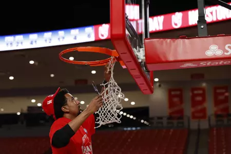 the University of Houston men's basketball cuts down the nets after claiming the 2020 regular season conference championship at the Fertitta Center on Sunday March 8, 2020 in Houston, Texas.Photo by Aaron M. Sprecher