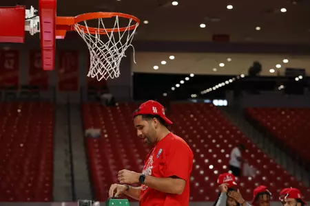 the University of Houston men's basketball cuts down the nets after claiming the 2020 regular season conference championship at the Fertitta Center on Sunday March 8, 2020 in Houston, Texas.Photo by Aaron M. Sprecher