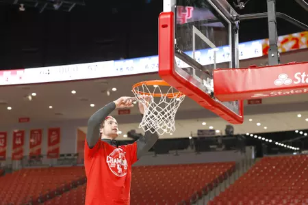 the University of Houston men's basketball cuts down the nets after claiming the 2020 regular season conference championship at the Fertitta Center on Sunday March 8, 2020 in Houston, Texas.Photo by Aaron M. Sprecher