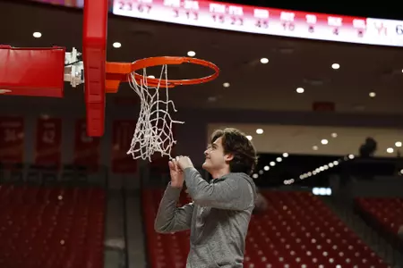 the University of Houston men's basketball cuts down the nets after claiming the 2020 regular season conference championship at the Fertitta Center on Sunday March 8, 2020 in Houston, Texas.Photo by Aaron M. Sprecher