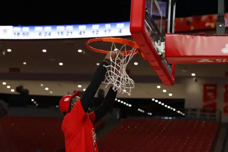the University of Houston men's basketball cuts down the nets after claiming the 2020 regular season conference championship at the Fertitta Center on Sunday March 8, 2020 in Houston, Texas.Photo by Aaron M. Sprecher