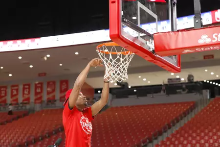 the University of Houston men's basketball cuts down the nets after claiming the 2020 regular season conference championship at the Fertitta Center on Sunday March 8, 2020 in Houston, Texas.Photo by Aaron M. Sprecher