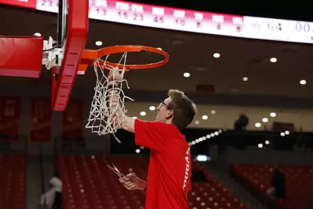 the University of Houston men's basketball cuts down the nets after claiming the 2020 regular season conference championship at the Fertitta Center on Sunday March 8, 2020 in Houston, Texas.Photo by Aaron M. Sprecher