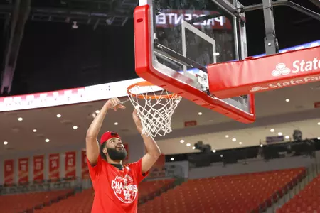 the University of Houston men's basketball cuts down the nets after claiming the 2020 regular season conference championship at the Fertitta Center on Sunday March 8, 2020 in Houston, Texas.Photo by Aaron M. Sprecher