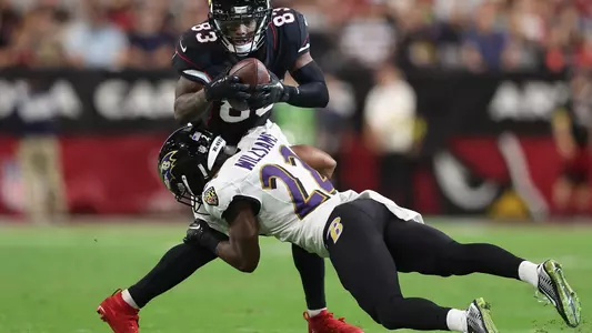 GLENDALE, ARIZONA - AUGUST 21: Wide receiver Greg Dortch #83 of the Arizona Cardinals makes a reception against cornerback Damarion Williams #22 of the Baltimore Ravens during the first half of the NFL preseason game at State Farm Stadium on August 21, 2022 in Glendale, Arizona. (Photo by Christian Petersen/Getty Images)