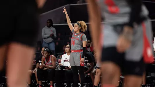 Laila Blair celebrates on bench vs UCF