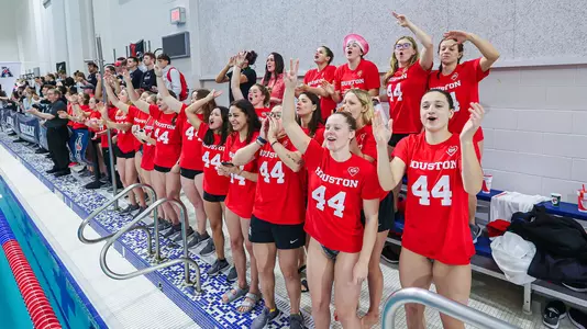 Members of the swimming & diving team cheering on teammates the 2023 American Athletic Conference Championships