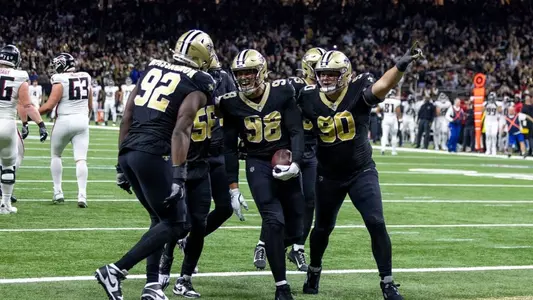 Payton Turner celebrates fumble recovery