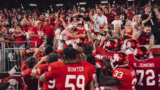 Jack Martin celebrates walk-off field goal in stands with friends fans