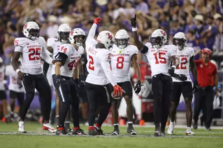 Oct 4, 2024; Fort Worth, Texas, USA; Houston Cougars defensive back A.J. Haulcy (2) celebrates making an interception against the TCU Horned Frogs with his teammates in the second quarter at Amon G. Carter Stadium. Mandatory Credit: Tim Heitman-Imagn Images