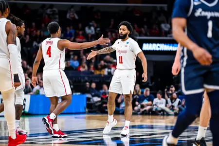 LJ Cryer and Damian Dunn handshake vs Longwood Lancers