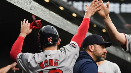 May 29, 2024; Baltimore, Maryland, USA; Boston Red Sox catcher Connor Wong (12) celebrates with teammates after scoring during the second inning against the Baltimore Orioles at Oriole Park at Camden Yards. Mandatory Credit: Tommy Gilligan-USA TODAY Sports