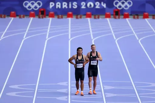 PARIS, FRANCE - AUGUST 08: Louie Hinchliffe and Richard Kilty of Team Great Britain react after competing in the Men's 4 x 100m Relay on day thirteen of the Olympic Games Paris 2024 at Stade de France on August 08, 2024 in Paris, France. (Photo by Michael Steele/Getty Images)