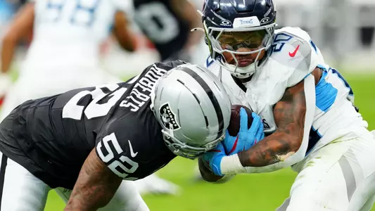Oct 12, 2025; Paradise, Nevada, USA; Las Vegas Raiders outside linebacker Elandon Roberts (52) tackles Tennessee Titans running back Tony Pollard (20) during the first half at Allegiant Stadium. Mandatory Credit: Stephen R. Sylvanie-Imagn Images