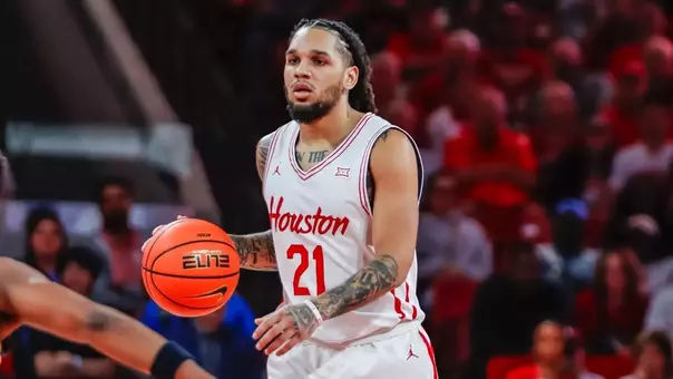 Emanuel Sharp dribbling the basketball