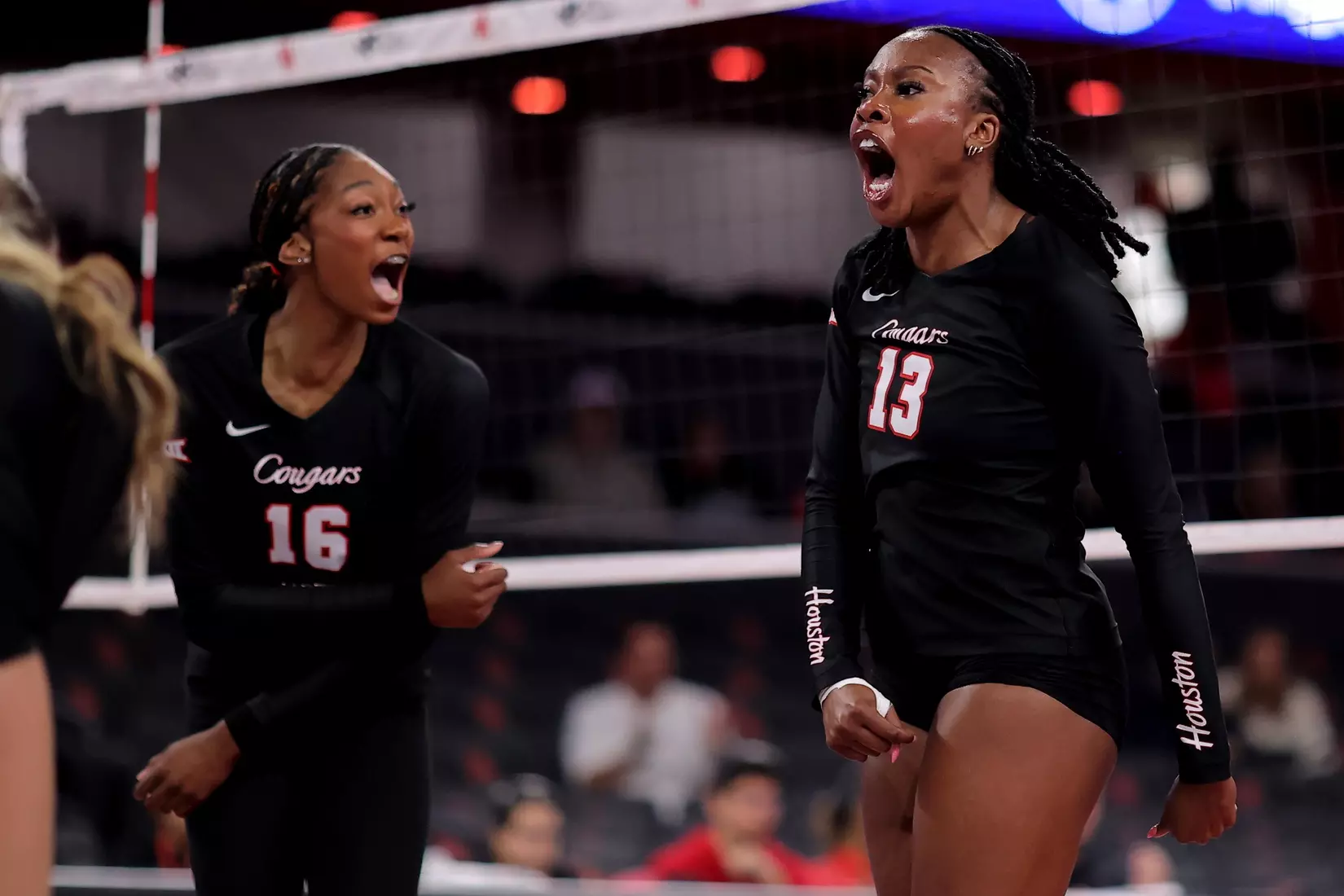 Barakat Rahmon and Bre Reid celebrate after winning a point.