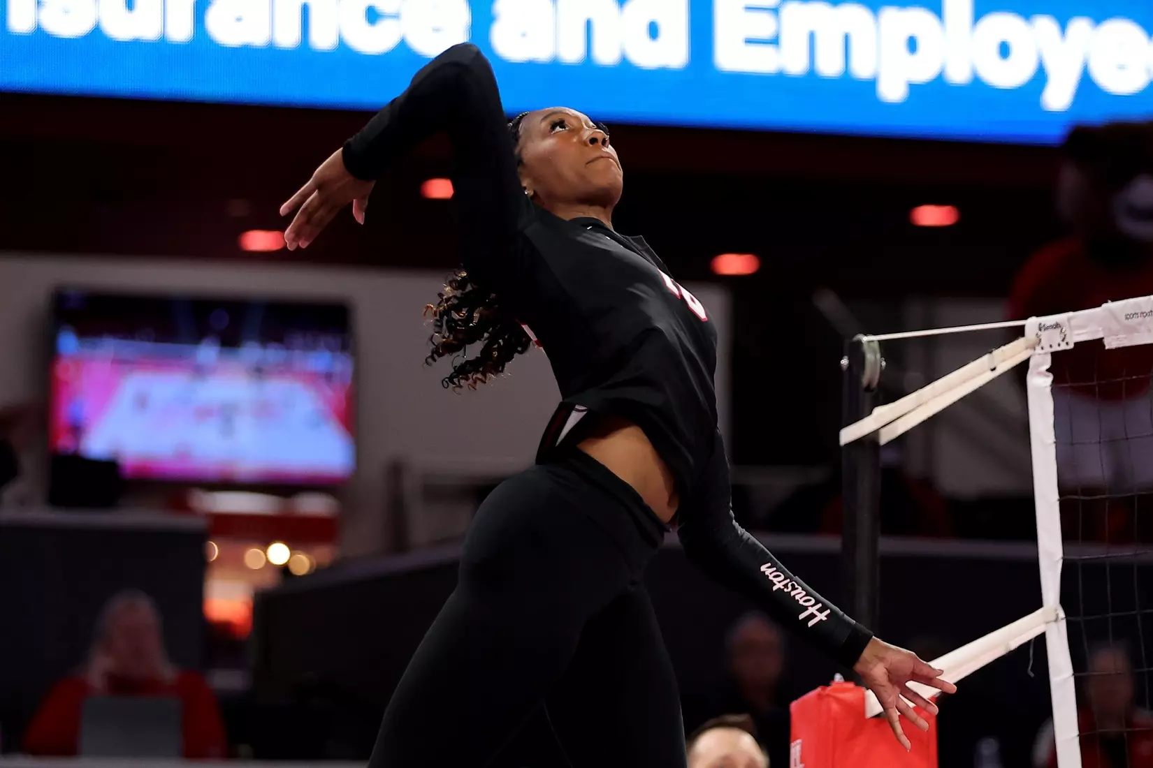 Bre Reid jumps to attack a ball.