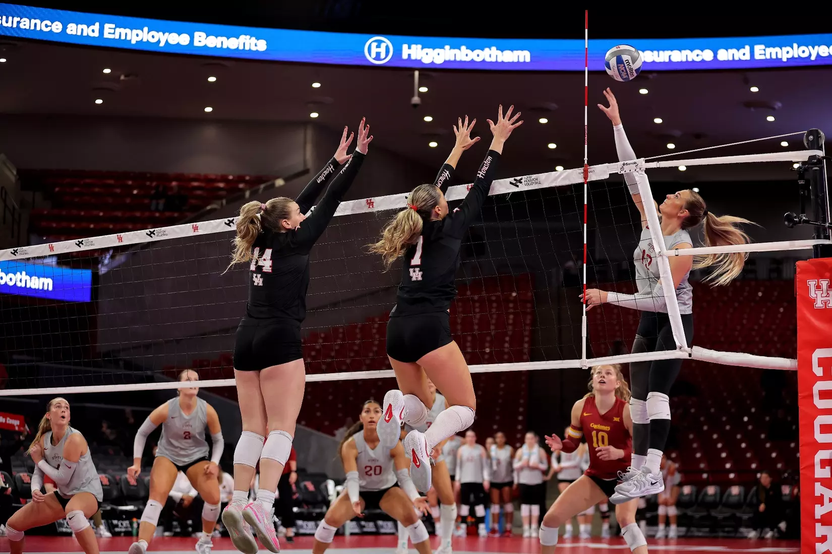 Ella Wendel and Olivia Klimis jump to block an attack by Iowa State.