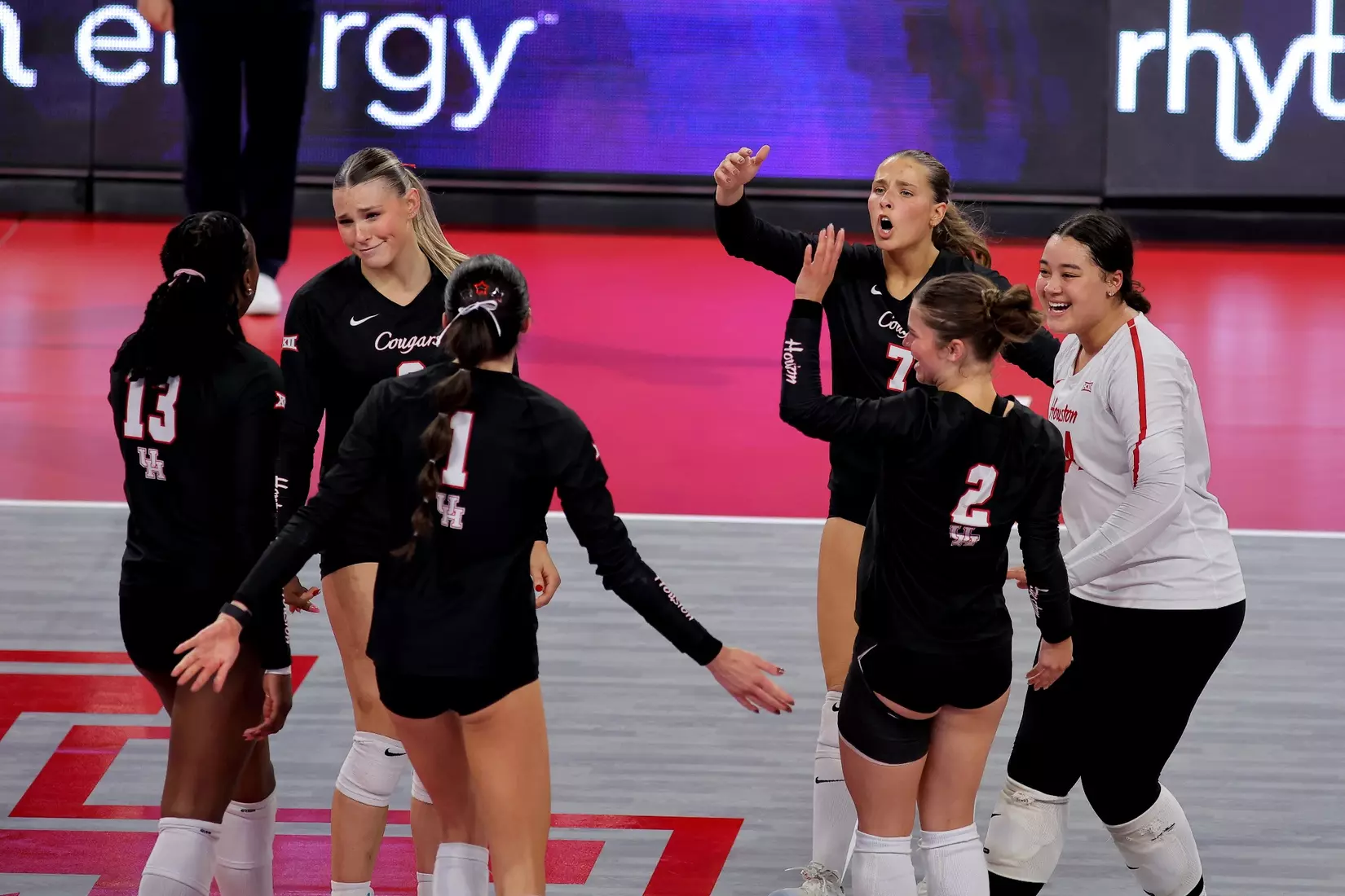 The Houston Volleyball team celebrates after a point.