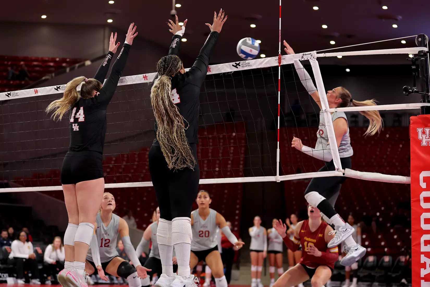 Ella Wendel and Tara Greenberry jump to block an attack by Iowa State.