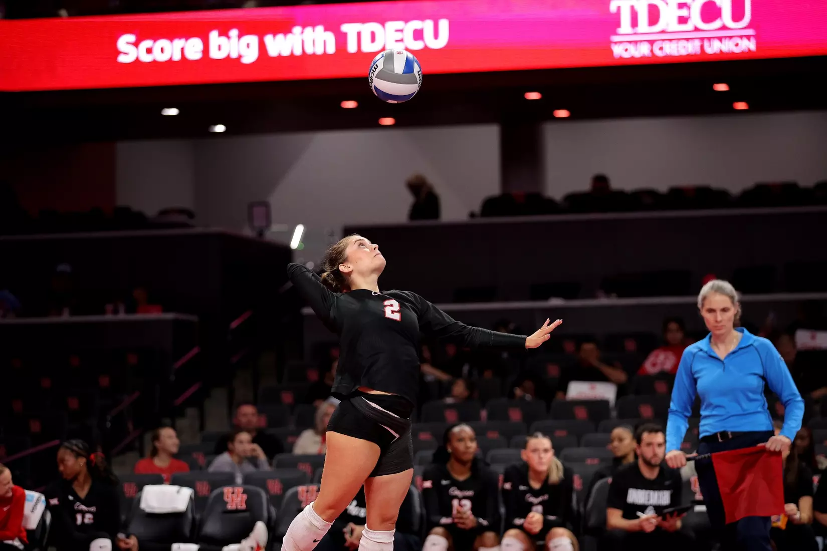 Alana Torres-Rivera jumps to serve a ball.