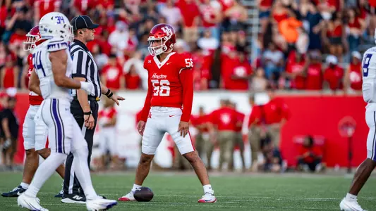 Jacob Garza stands over ball vs. SFA