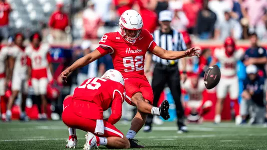 Ethan Sanchez kicks field goal with Jake Sock holding